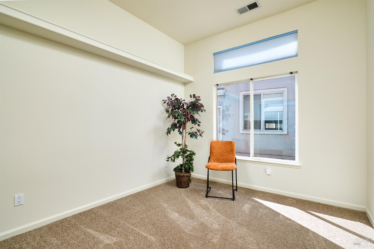 48 Augusta Court Rio Vista, CA 94571 - Photo 23 of 32 an empty room with chair and potted plant