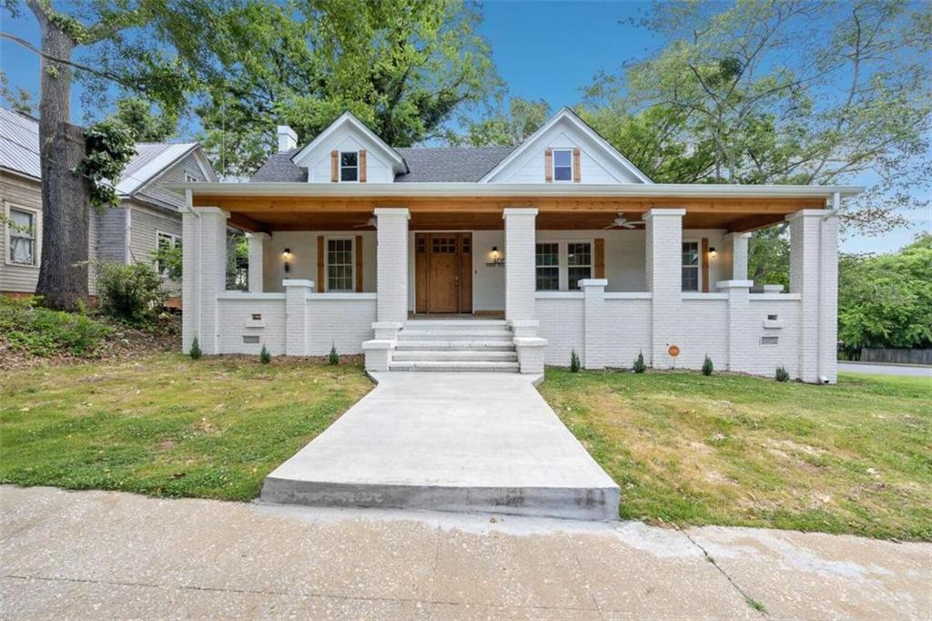 front view of a house with a yard