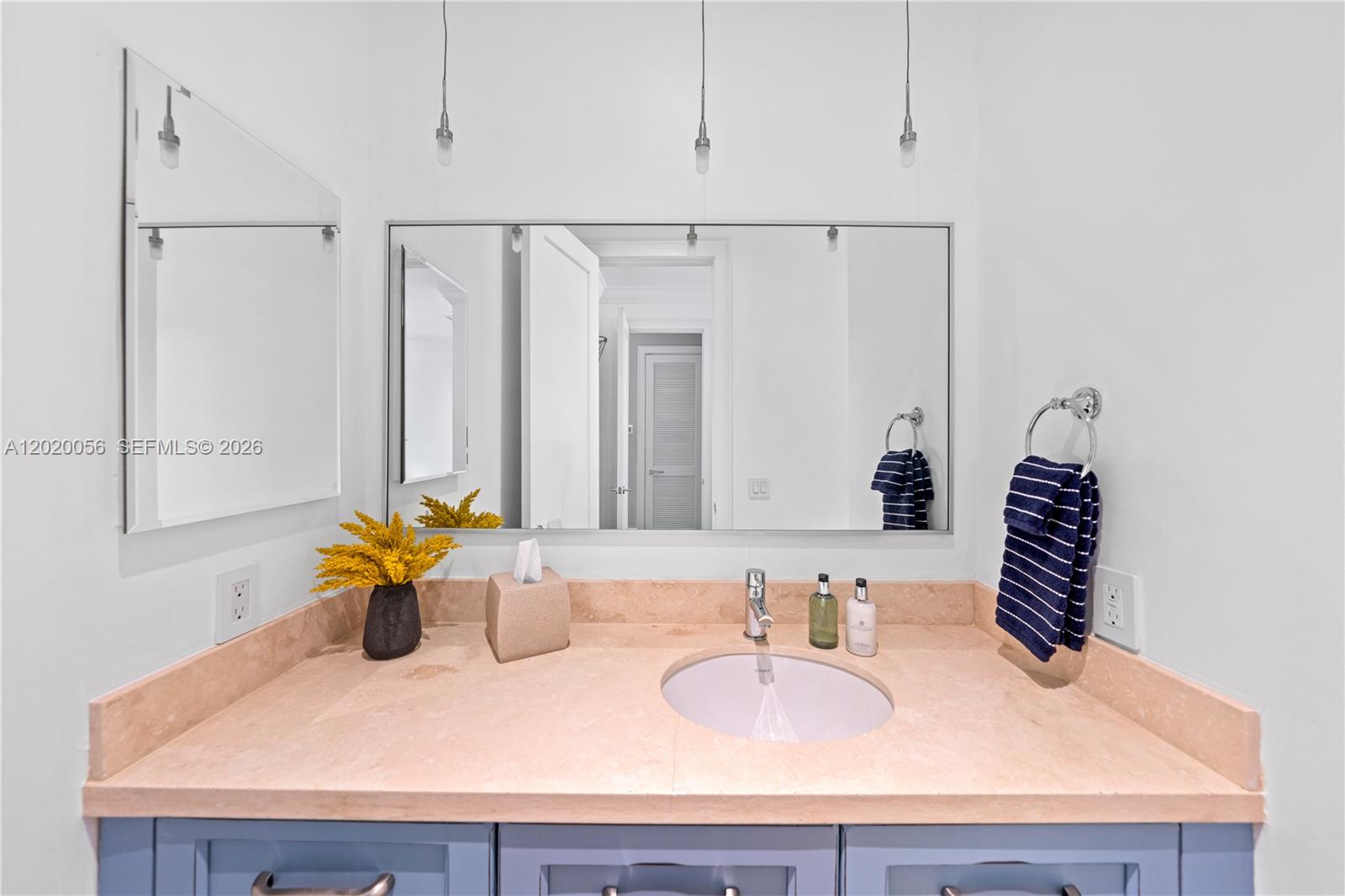 4196 Douglas Road Miami, FL 33133 - Photo 68 of 96 a bathroom with a sink and a mirror