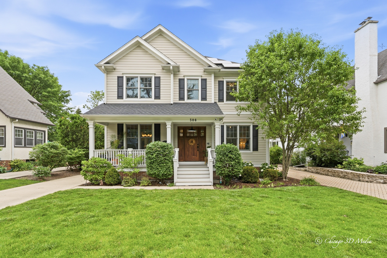306 17th Street Wilmette, IL 60091 - Photo 2 of 48 a front view of a house with a yard