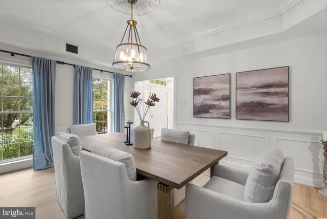 a bathroom with a granite countertop sink a potted plant and a window
