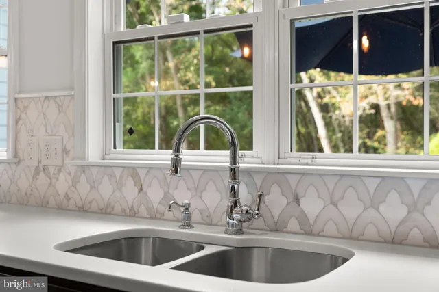 a bathroom with a sink vanity and a mirror