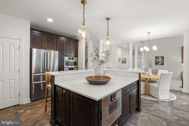a living room with furniture a fireplace and a table