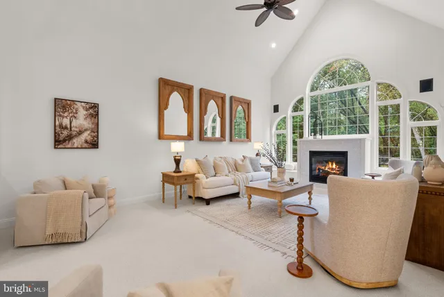a view of a patio with a table chairs and a barbeque