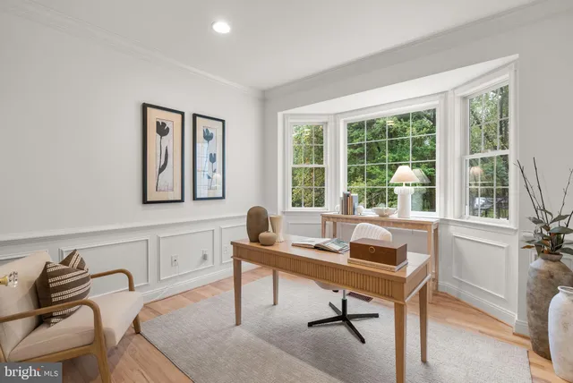 a view of a patio with couches table and chairs and potted plants