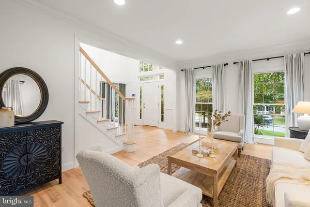 a view of a hallway with paintings on the wall