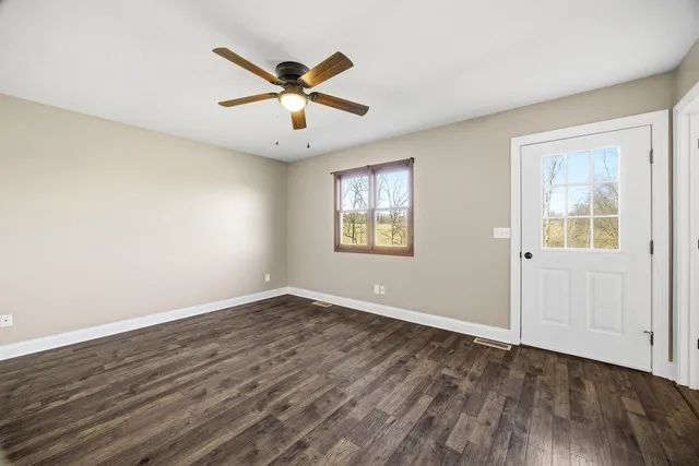 a view of an empty room with a window