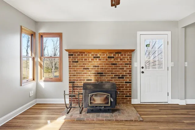 a kitchen with stainless steel appliances granite countertop a sink dishwasher stove and wooden cabinets