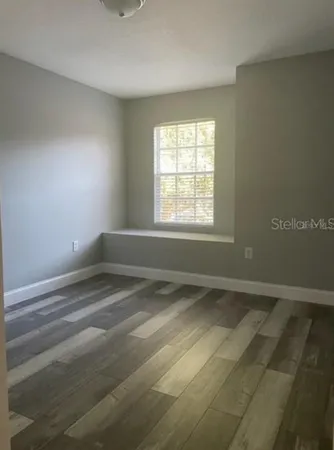 a view of an empty room with a window