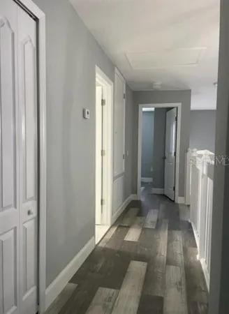 a view of a hallway with a livingroom