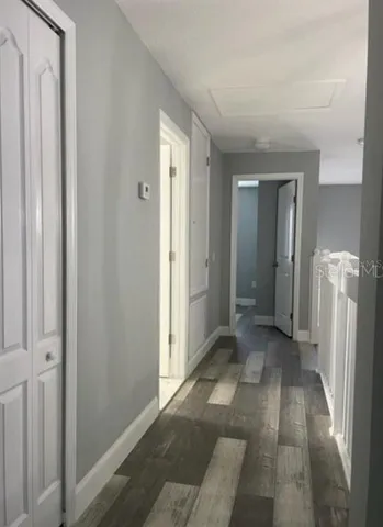 a view of a hallway with a livingroom