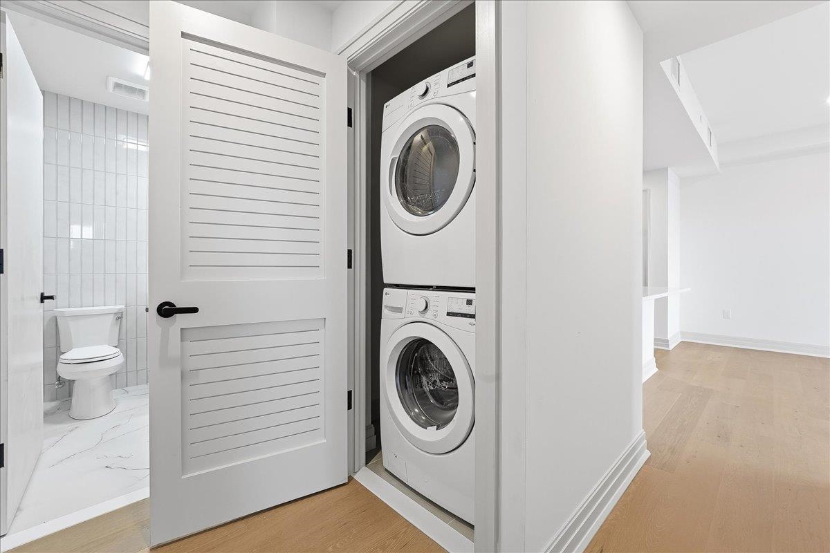 921 Madison Street, Unit 604 Hoboken, NJ 07030 - Photo 16 of 22 a utility room with sink dryer and washer
