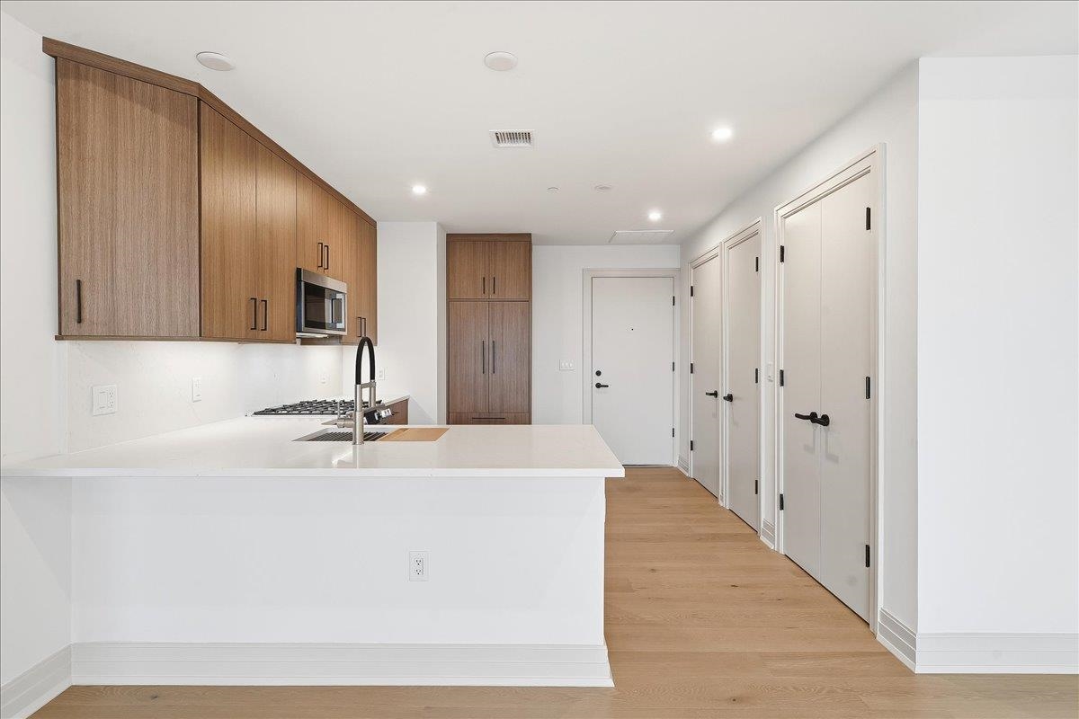 921 Madison Street, Unit 604 Hoboken, NJ 07030 - Photo 5 of 22 a view of a kitchen with a sink