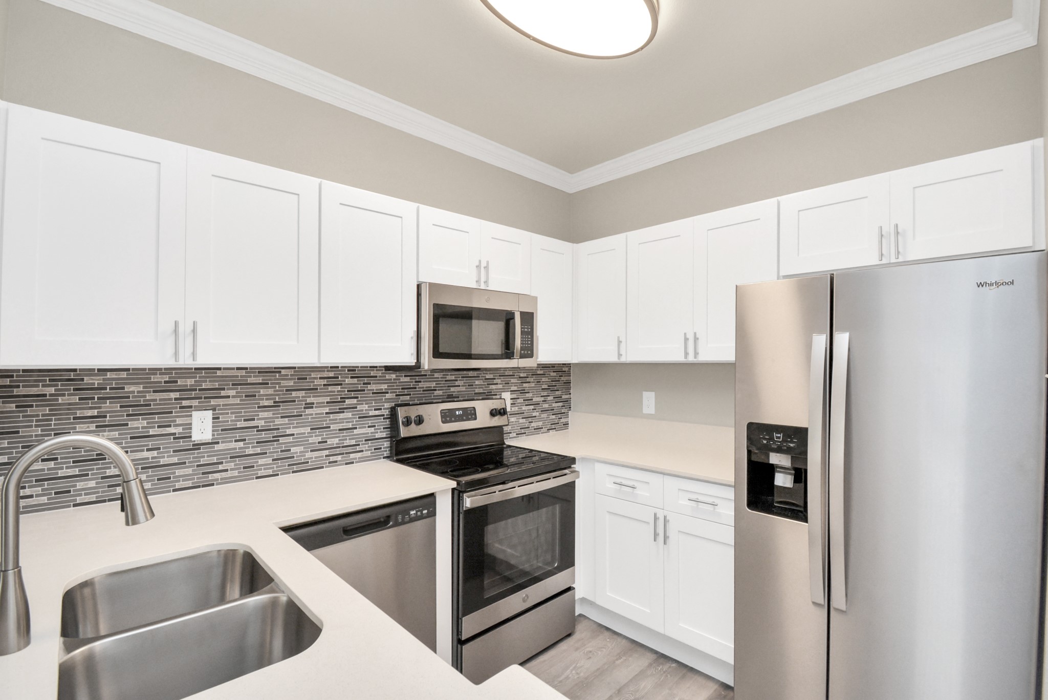 2222 Maroneal Street, Unit 214 Houston, TX 77030 - Photo 6 of 15 a kitchen with stainless steel appliances granite countertop a refrigerator sink and stove