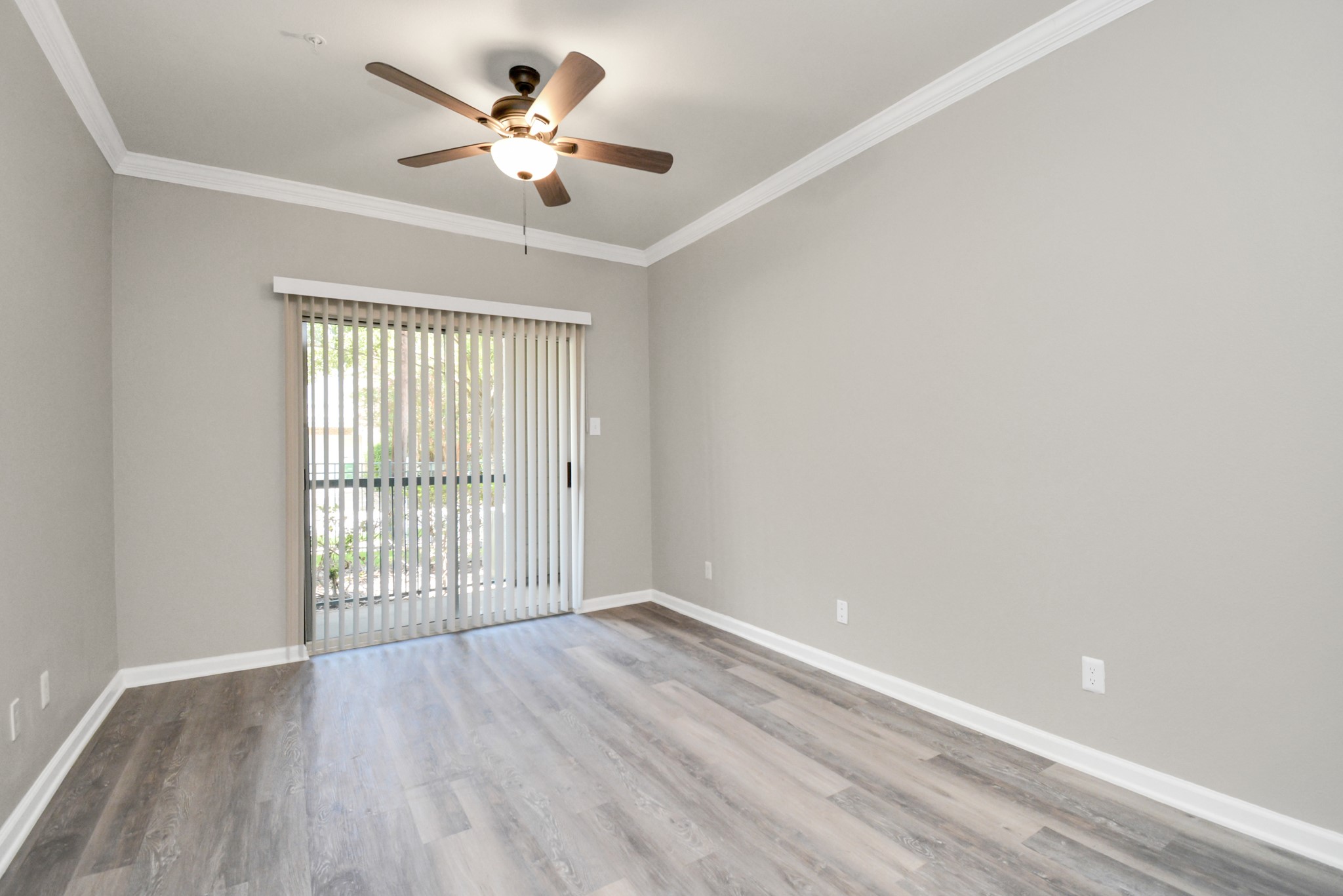2222 Maroneal Street, Unit 214 Houston, TX 77030 - Photo 7 of 15 wooden floor in an empty room with a window