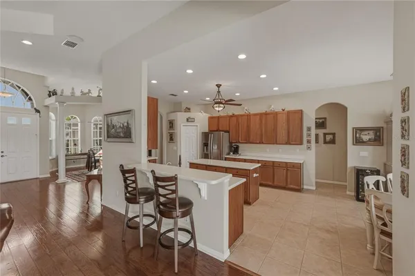 a kitchen with a sink a counter top stainless steel appliances and cabinets