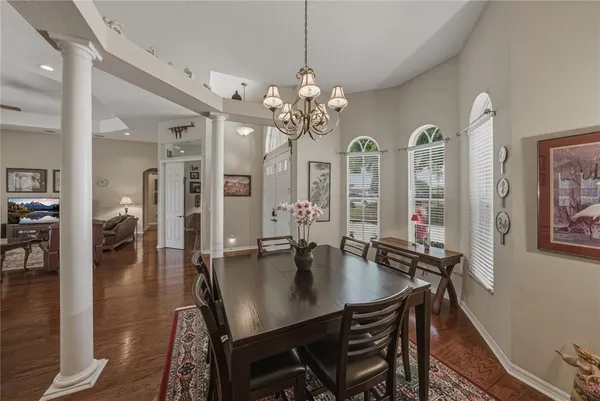 a bathroom with a granite countertop toilet a sink and a bathtub