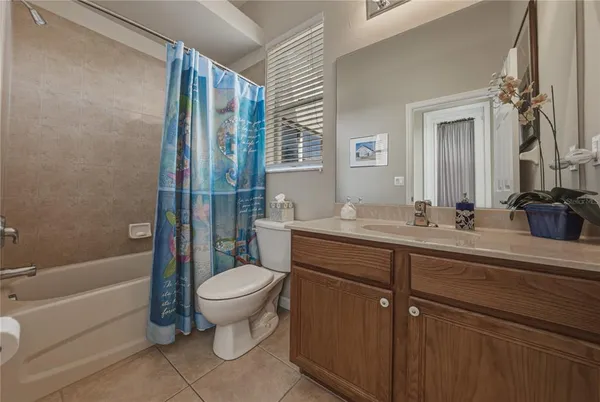 a large kitchen with stainless steel appliances granite countertop a sink and a stove