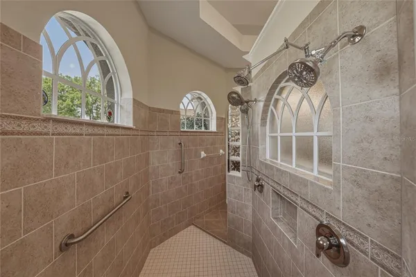 a living room with furniture and large window