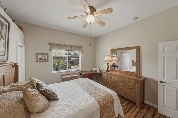 a view of a house with a yard and potted plants