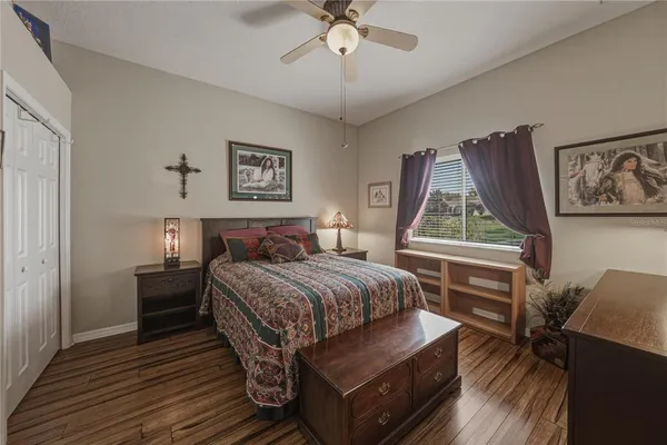 a view of a balcony with chairs and iron fence