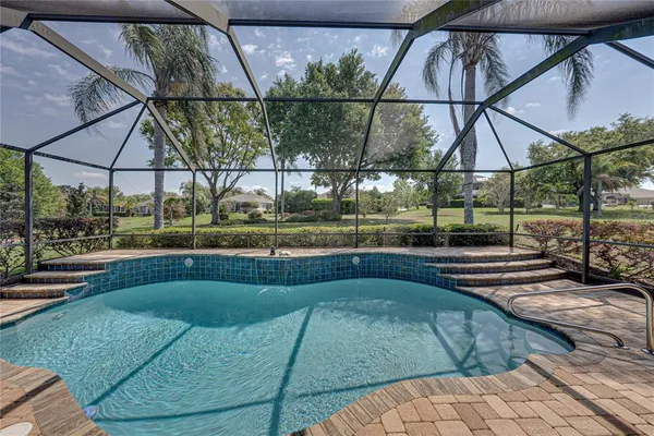 an aerial view of a residential houses with outdoor space and street view