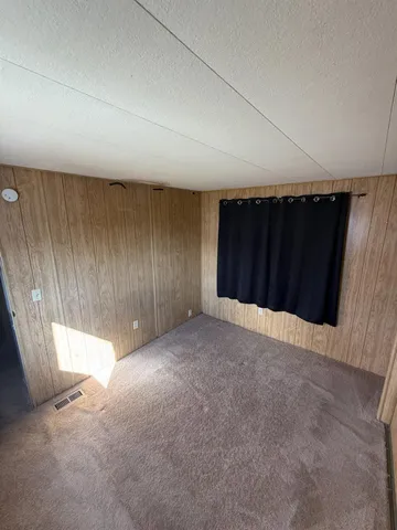 an empty room with a wooden door