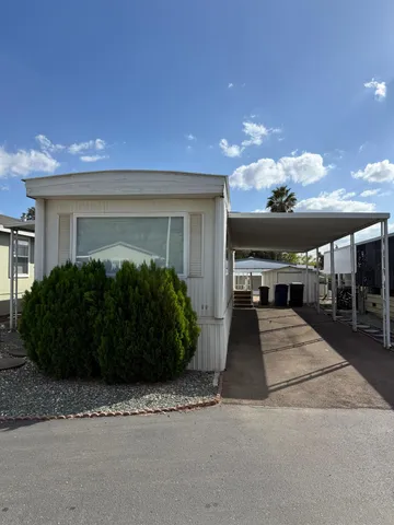 a view of a house with entertaining space