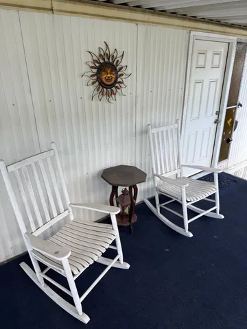 a living room with a bed and a table