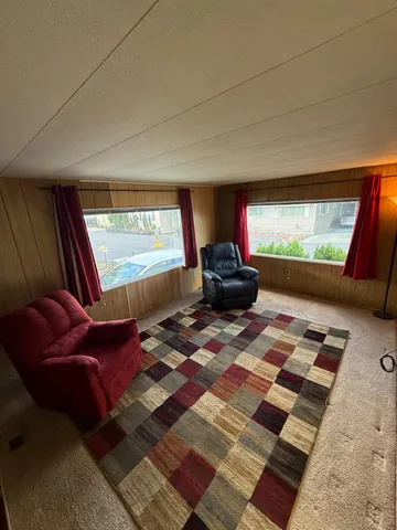 a living room with a couch and a large window