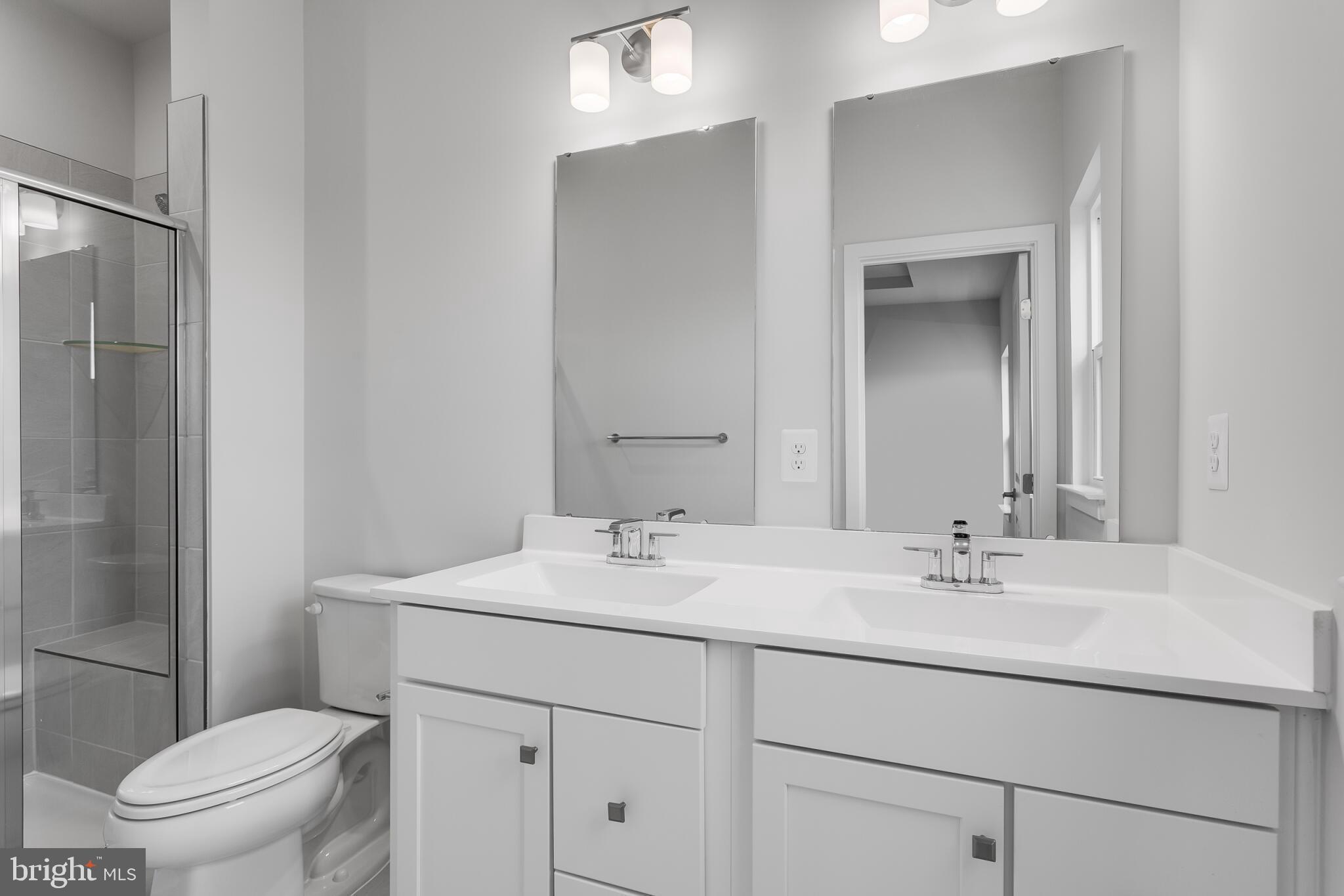 1729 Destrier Street Ranson, WV 25438 - Photo 14 of 16 a bathroom with a sink toilet vanity and a mirror