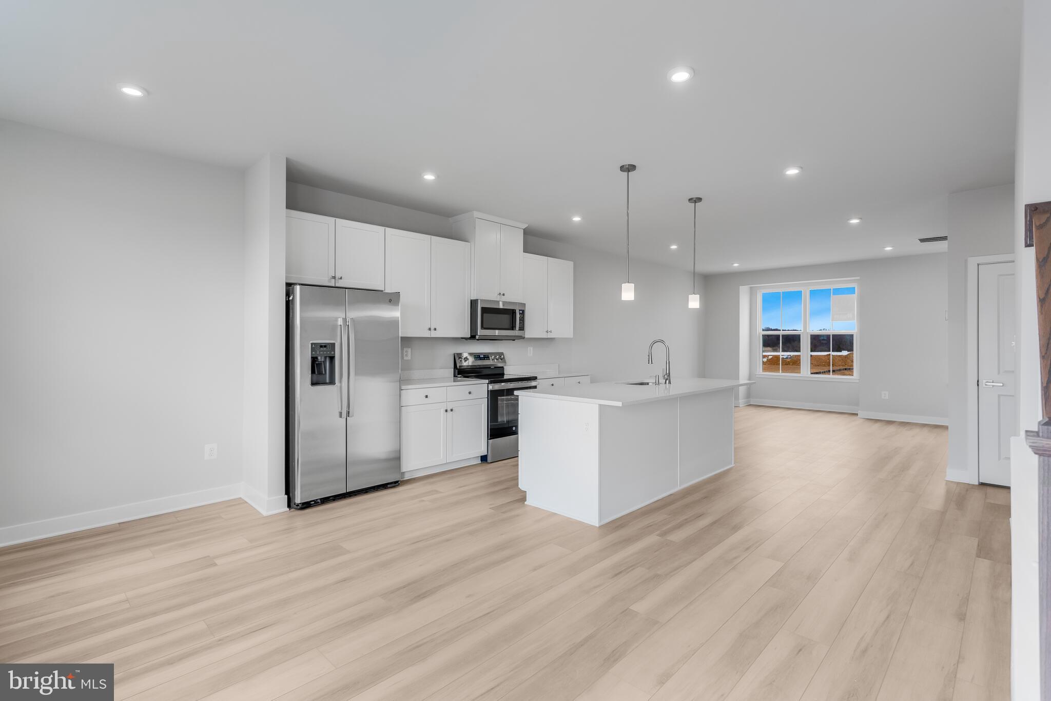 1729 Destrier Street Ranson, WV 25438 - Photo 5 of 16 a view of kitchen with refrigerator sink and wooden floor