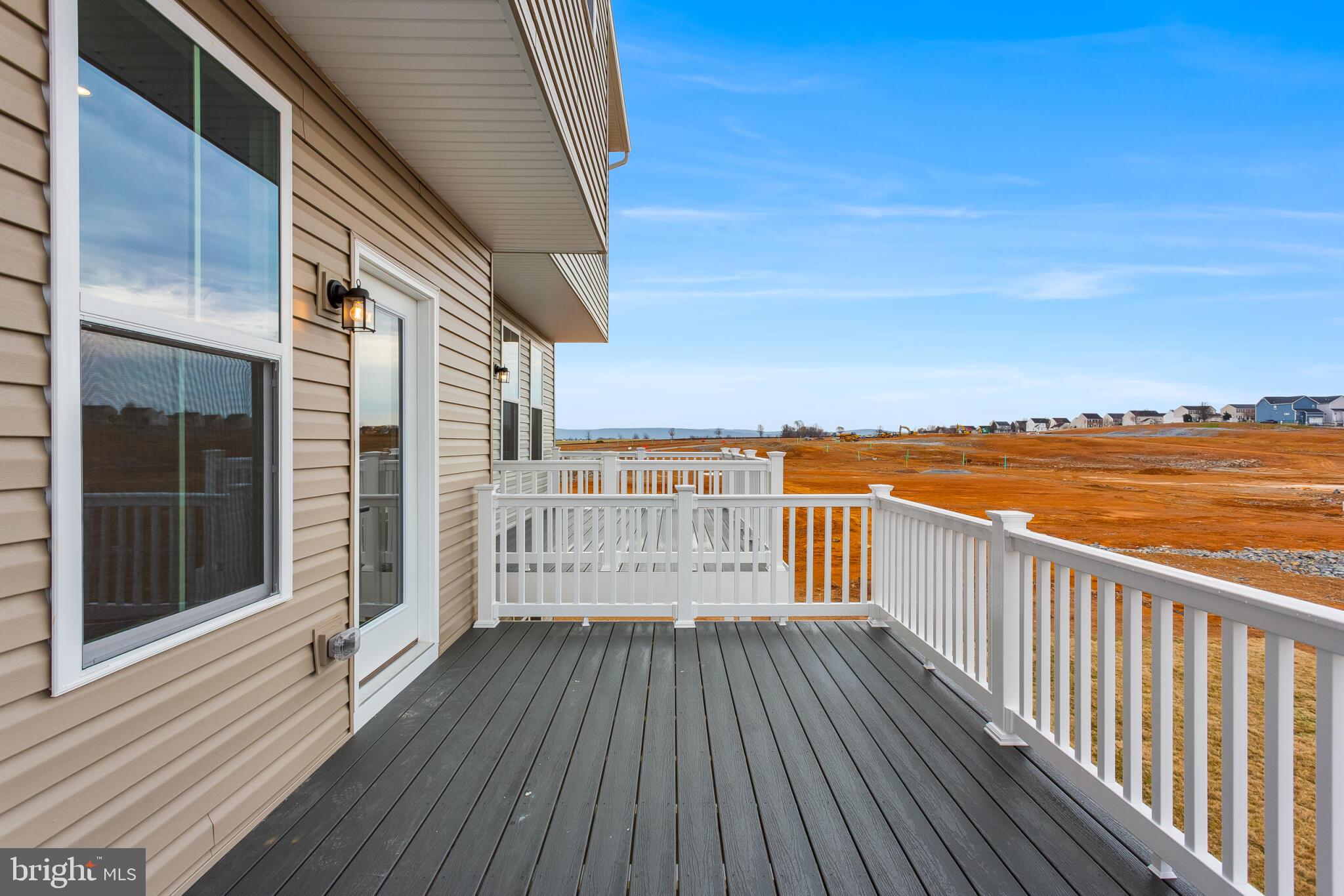 1729 Destrier Street Ranson, WV 25438 - Photo 6 of 16 a balcony with view of wooden floor