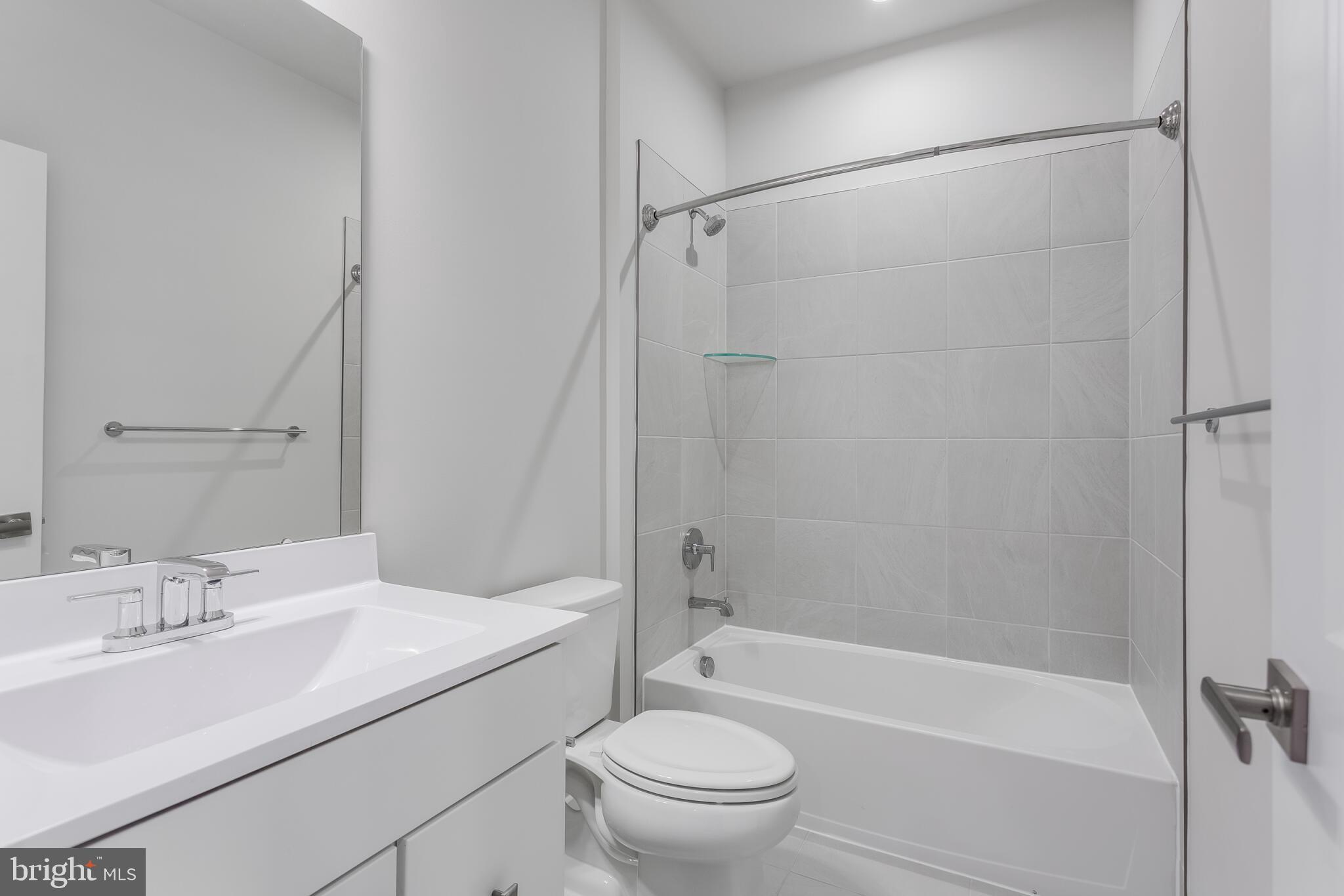 1729 Destrier Street Ranson, WV 25438 - Photo 8 of 16 a bathroom with a sink toilet and shower