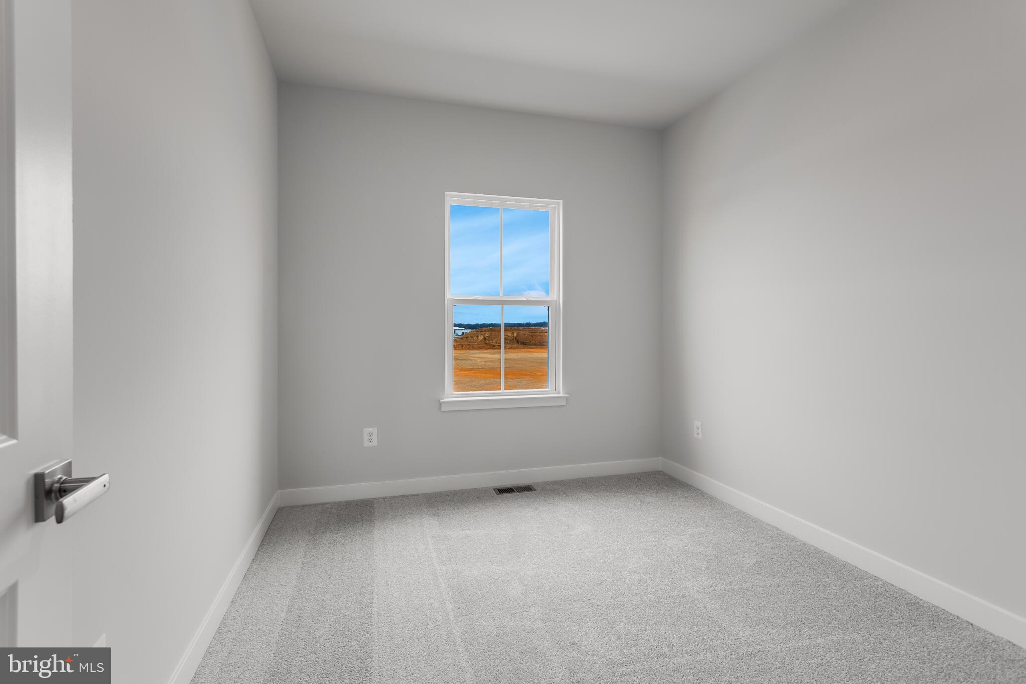 1729 Destrier Street Ranson, WV 25438 - Photo 9 of 16 a view of an empty room with a window