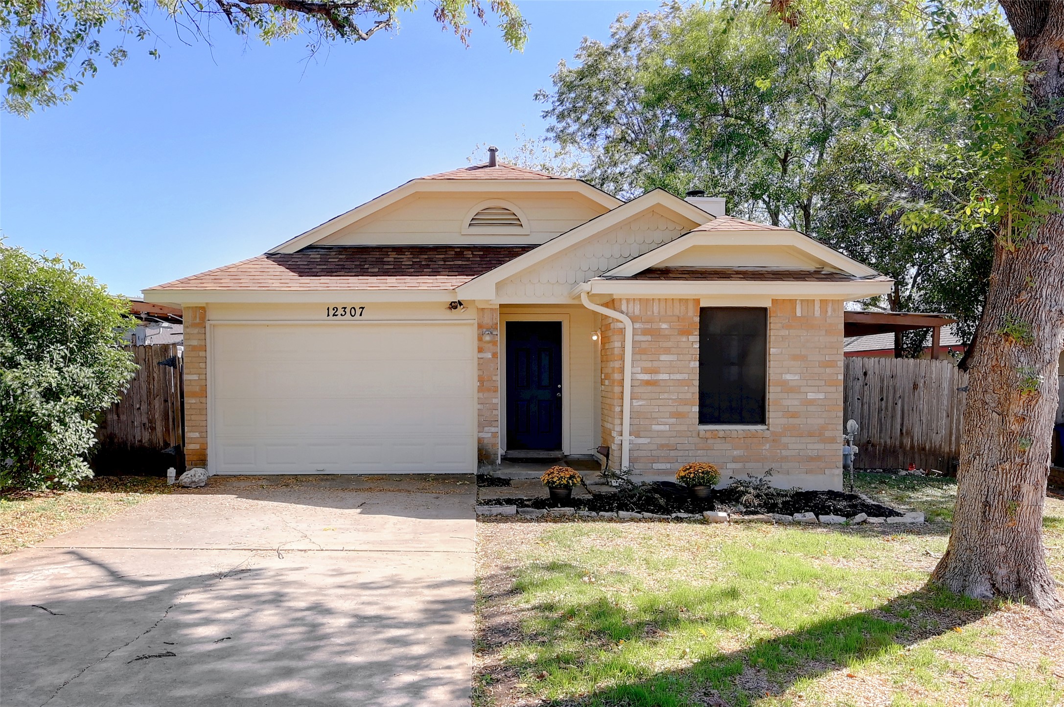 12307 Limerick Avenue Austin, TX 78758 - Photo 1 of 1 a front view of house with yard