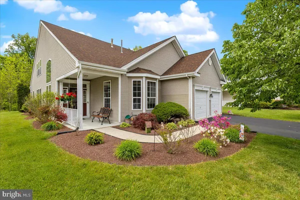 a front view of house with yard and outdoor seating