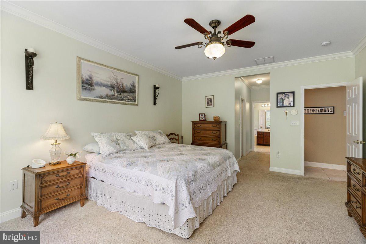 10 Fitzgerald Lane Columbus, NJ 08022 - Photo 14 of 33 a bedroom with a large bed and a chandelier