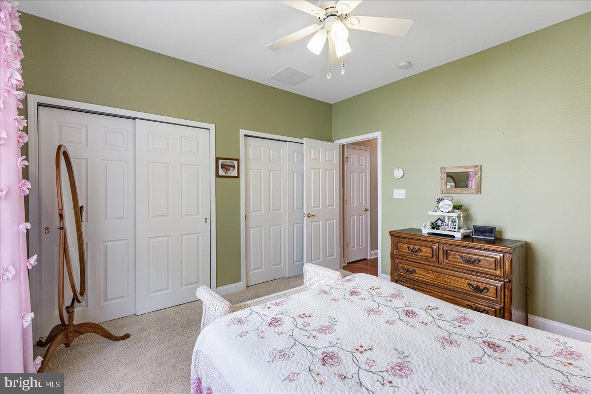 10 Fitzgerald Lane Columbus, NJ 08022 - Photo 18 of 33 a bedroom with a bed and a chandelier