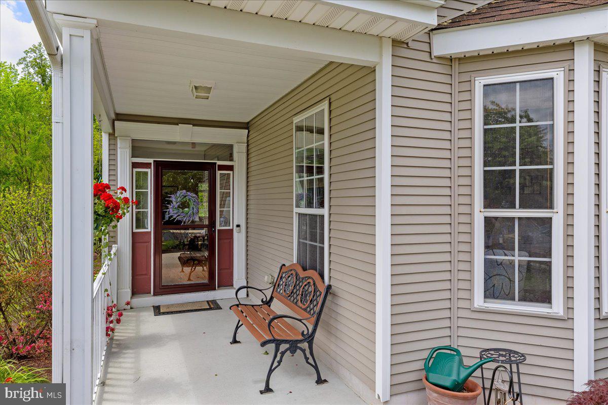 10 Fitzgerald Lane Columbus, NJ 08022 - Photo 2 of 33 a view of a door with a chairs and table in a patio