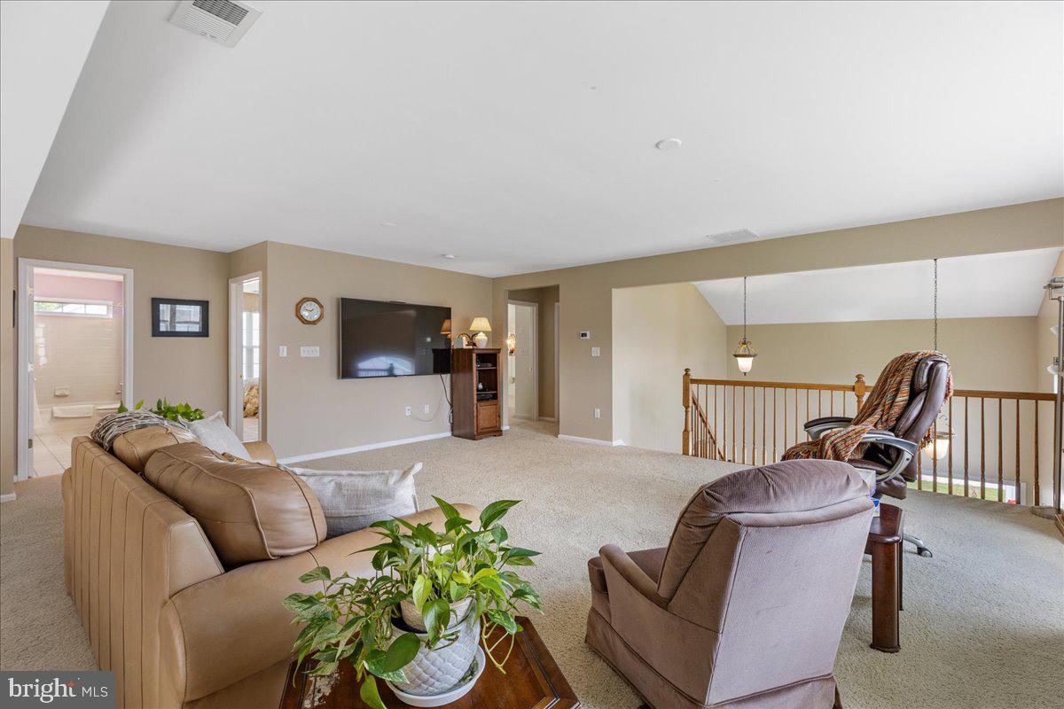 10 Fitzgerald Lane Columbus, NJ 08022 - Photo 22 of 33 a living room with furniture and a flat screen tv