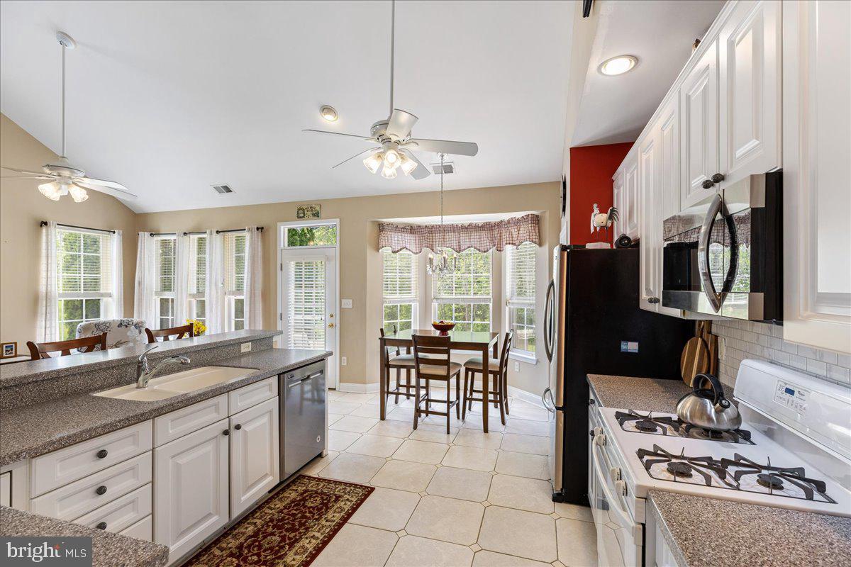 10 Fitzgerald Lane Columbus, NJ 08022 - Photo 10 of 33 a large kitchen with a large counter space appliances and furniture