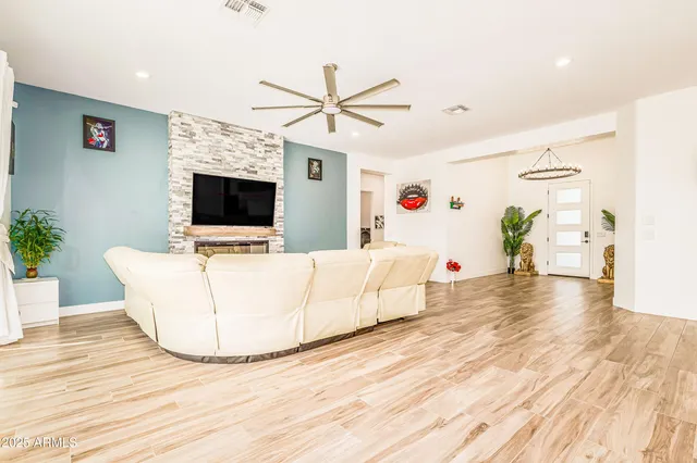 a view of a dining room with furniture and wooden floor