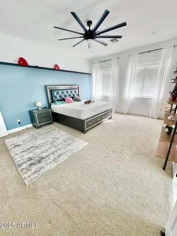 a large white tub sitting in a bathroom