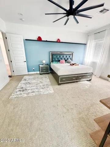a spacious bathroom with a tub sink and mirror