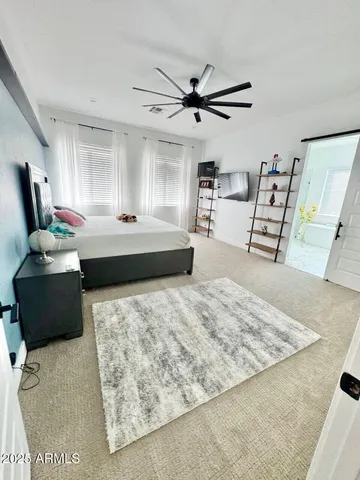 a bathroom with a sink vanity and mirror