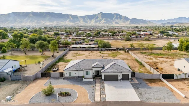 a view of a house with a mountain yard