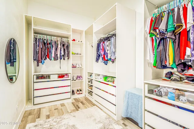 a bathroom with a sink vanity mirror and toilet