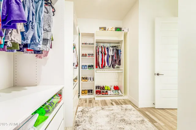 a bathroom with a bath tub with a shower