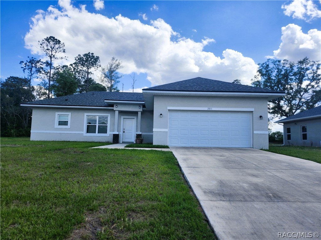 2800 Southwest 139th Street Ocala, FL 34473 - Photo 1 of 16 a front view of a house with a garden